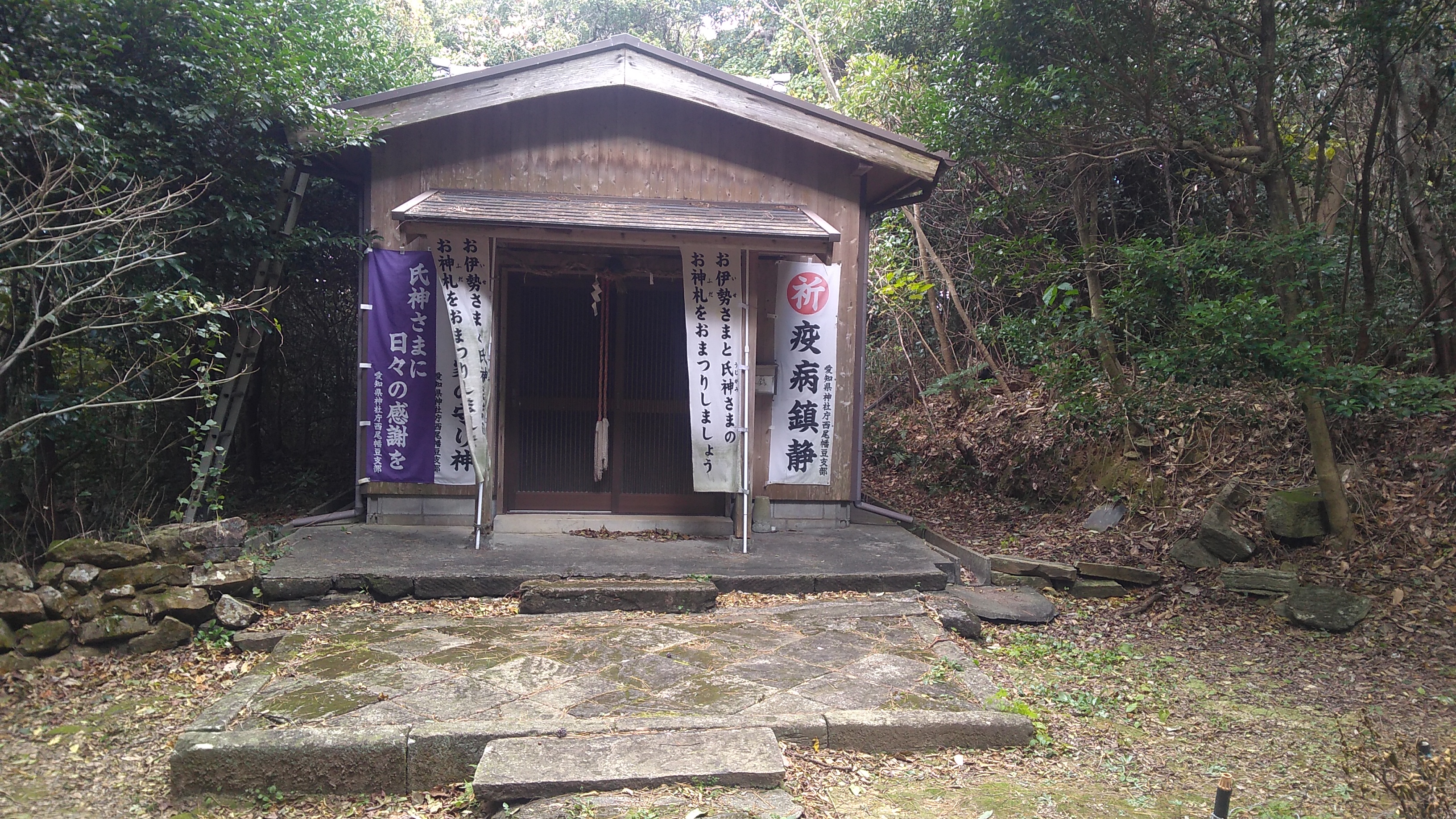 A small Buddhist temple nestled in a woodland.