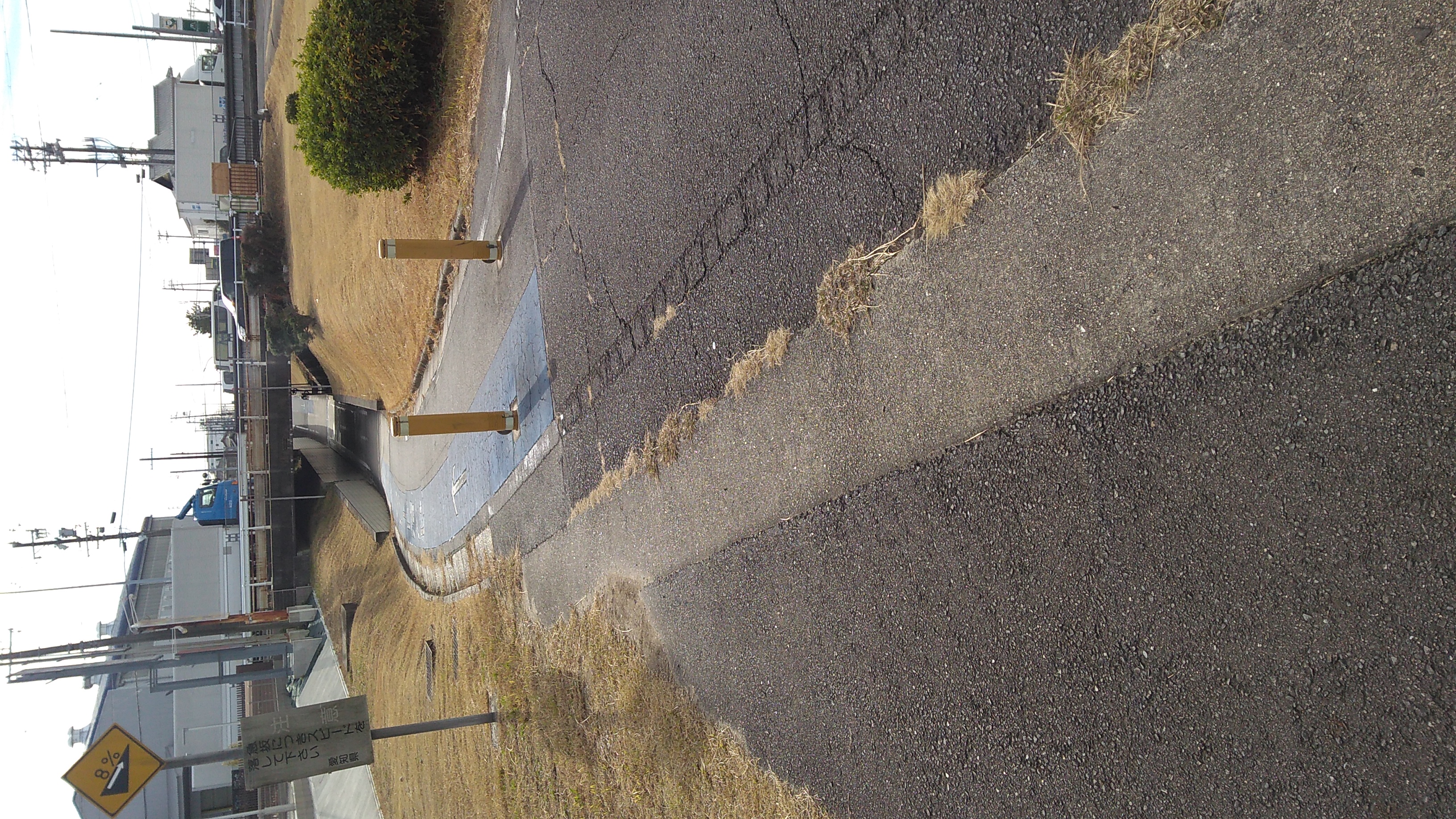 A bicycle-path underpass dipping under a road.